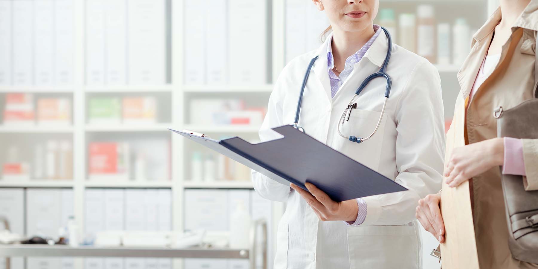 Doctor showing patient medical records