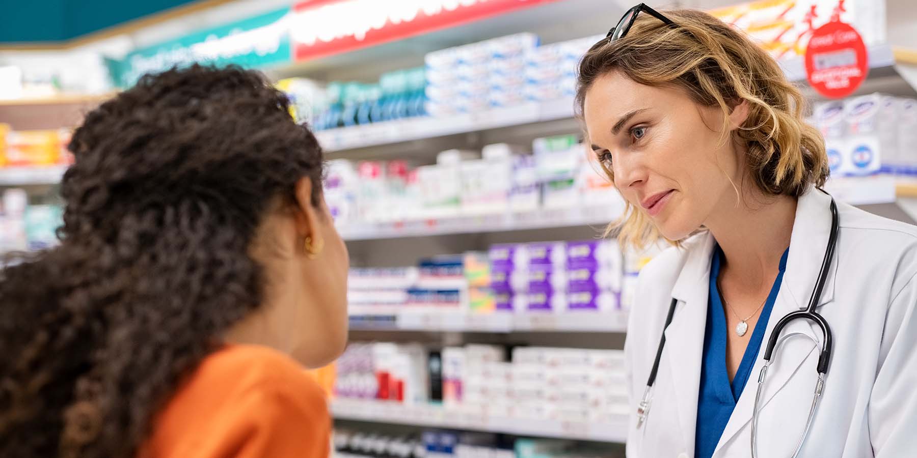 Pharmacist discussing prescription with patient