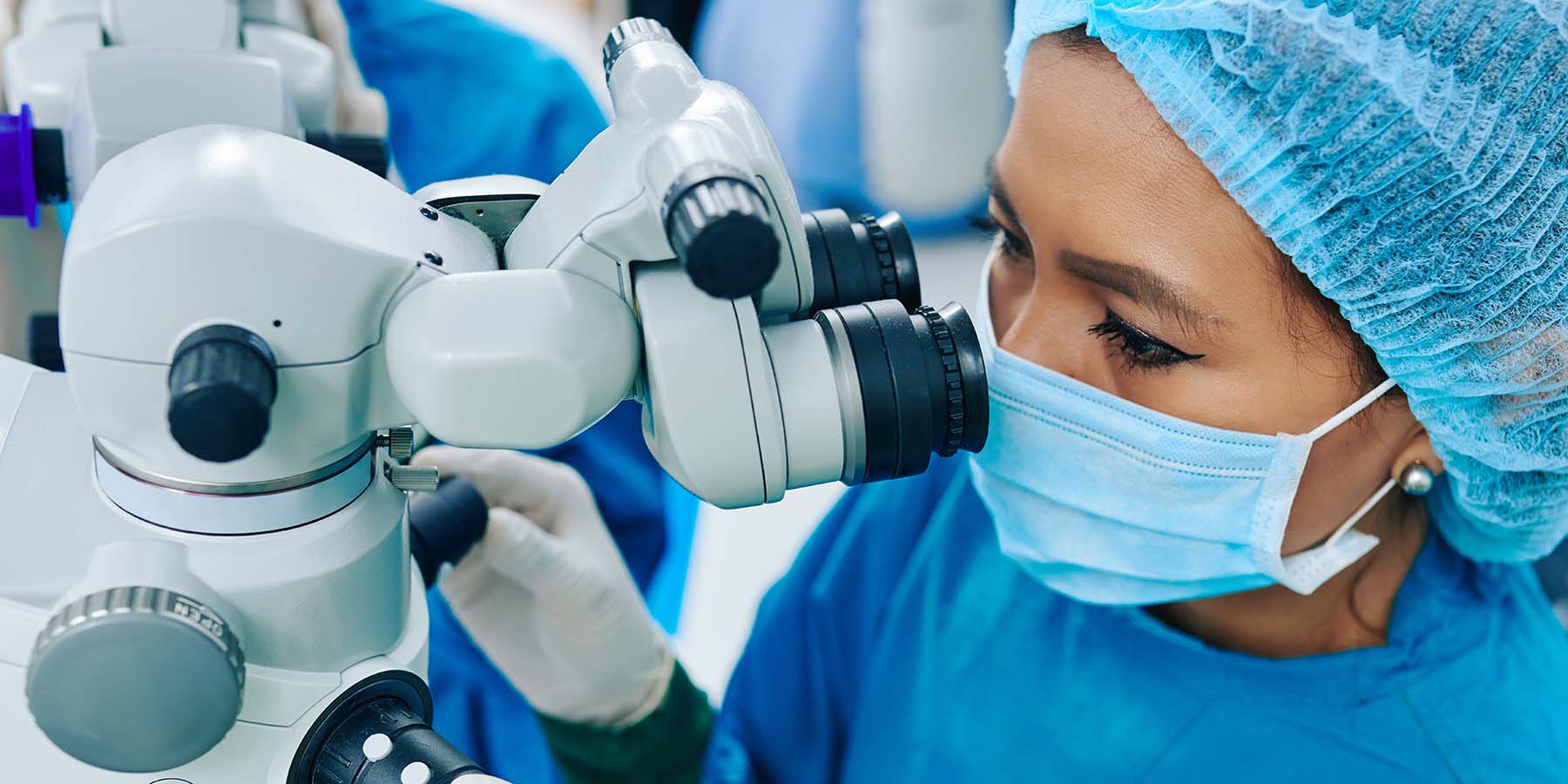 Ophthalmic surgeon operating on outpatient